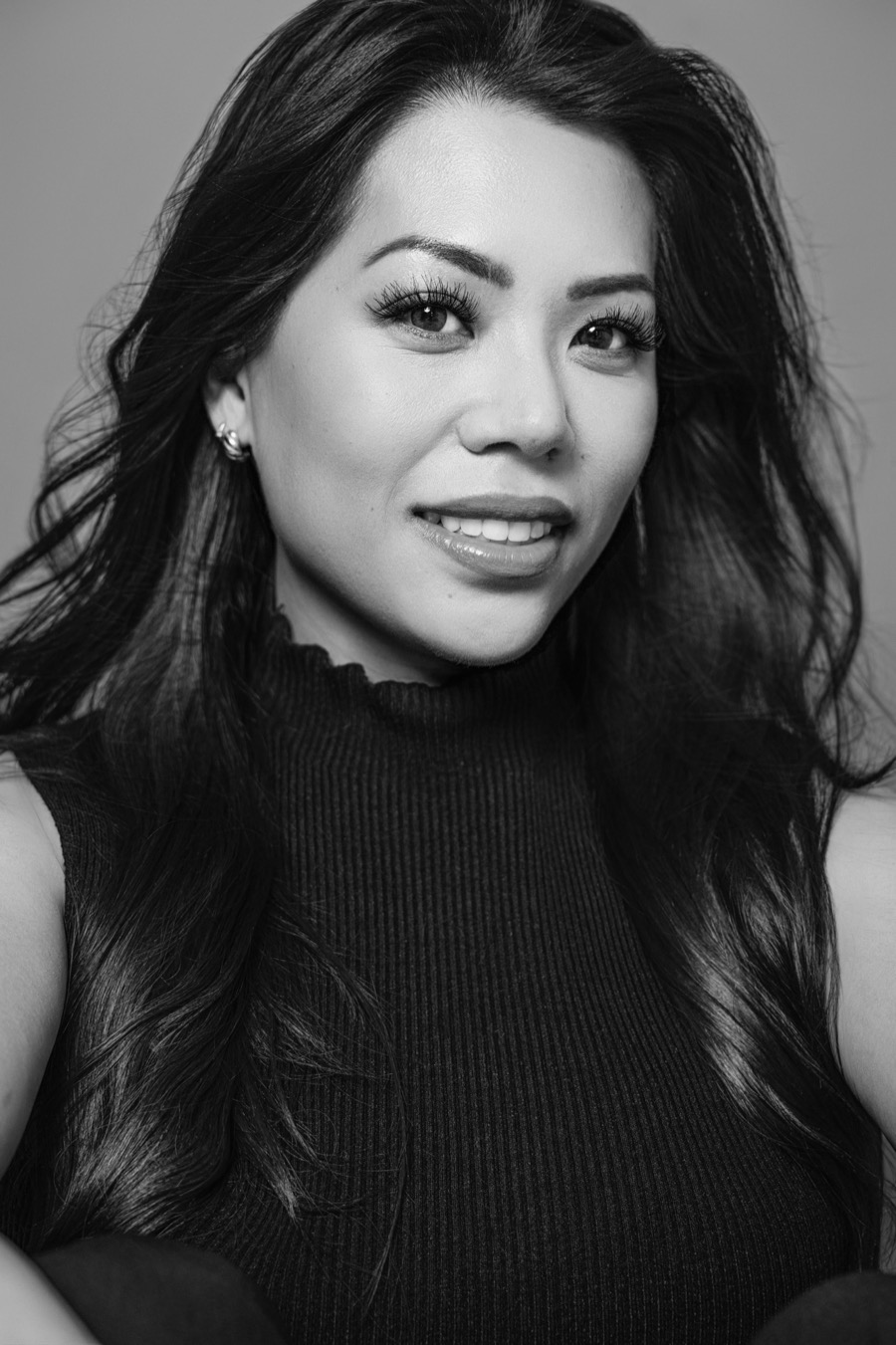 Black-and-white portrait of Michelle Liam, smiling.